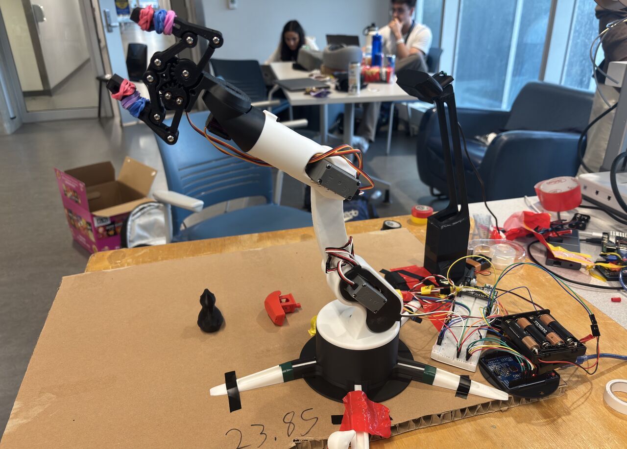 Dum-E, the 3D-printed robotic arm, mid-build at Hack the North